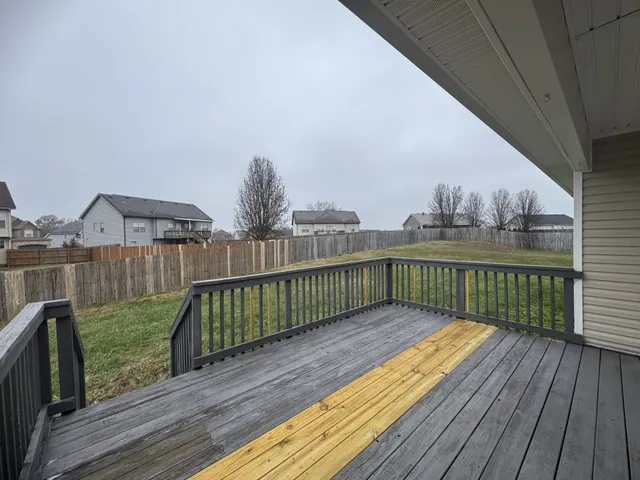 a view of balcony with deck and wooden floor