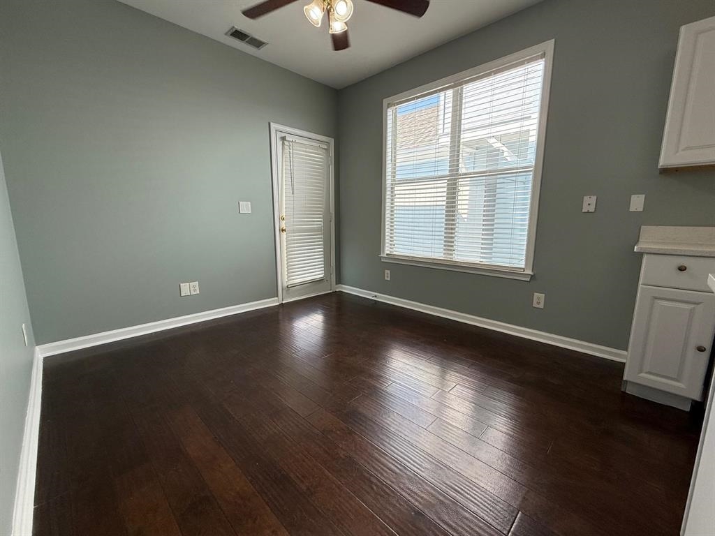 1173 Island Place East Memphis, TN 38103 - Photo 4 of 18 Unfurnished dining area with a ceiling fan and dark wood-style flooring