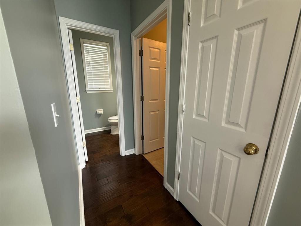 1173 Island Place East Memphis, TN 38103 - Photo 7 of 18 Hallway featuring baseboards and dark wood-style flooring
