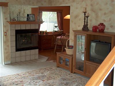 20 Meridian Circle Rohnert Park, CA 94928 - Photo 3 of 12 a living room with furniture a fireplace and a flat screen tv