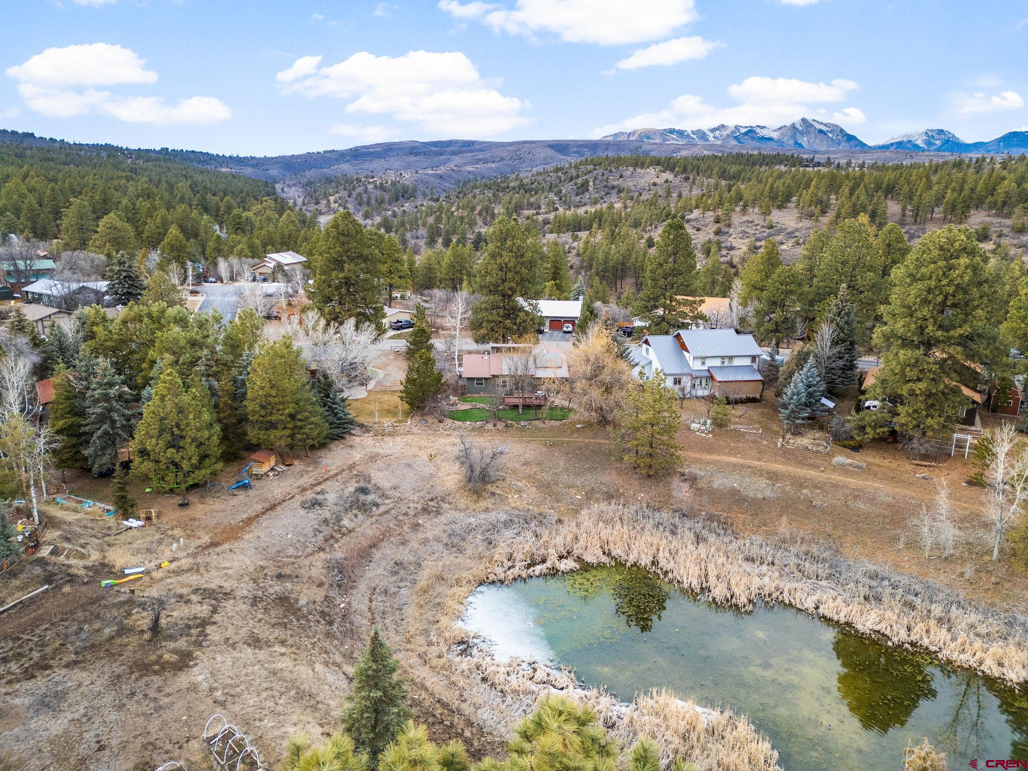 136 Oak Drive Durango, CO 81301 - Photo 5 of 29 a view of a lake with mountains in the background