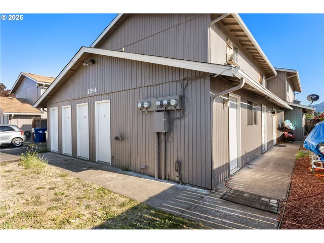a view of a house with wooden walls