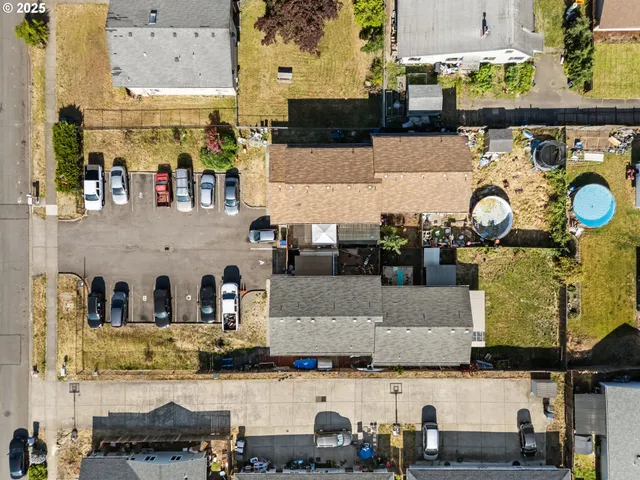 an aerial view of a house with a lake view