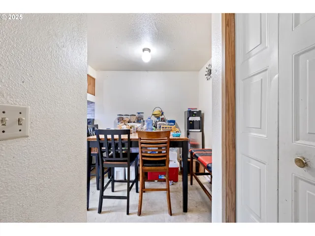 a kitchen with stainless steel appliances a sink stove and window