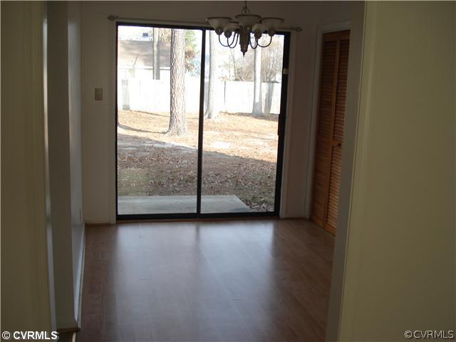 4452 Baxter Road Prince George, VA 23875 - Photo 4 of 4 a view of a room with wooden floor and doors