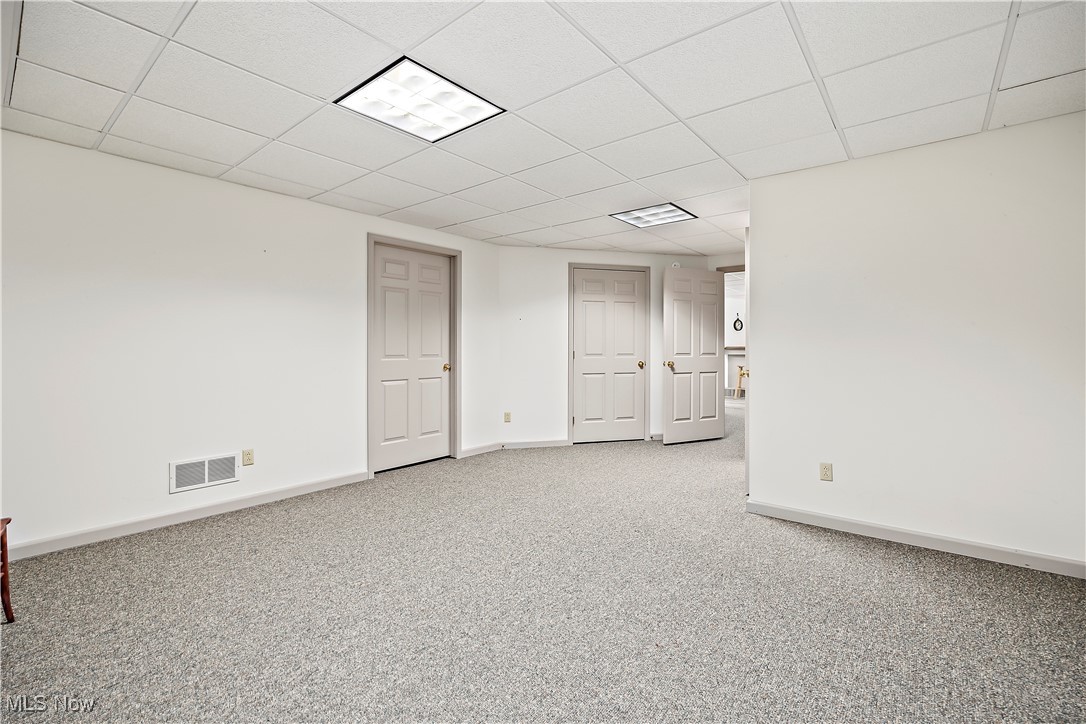 13901 Shaw Mill Road Milan, OH 44846 - Photo 24 of 42 Empty room with a drop ceiling and light carpet