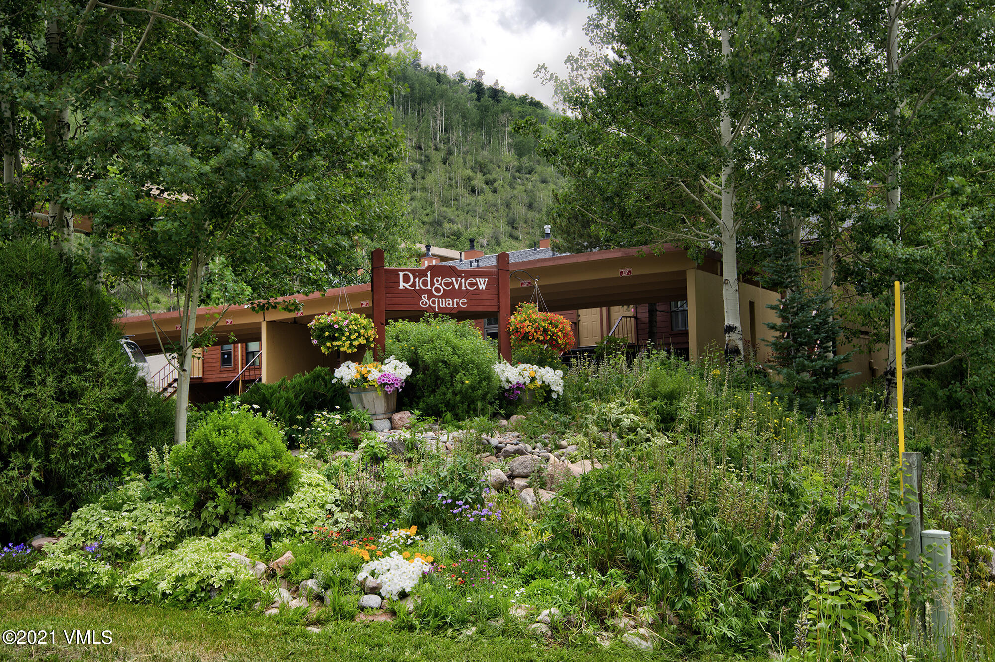 4506 Spruce Way, Unit 4 Vail, CO 81657 - Photo 1 of 31 front view of a house with a yard