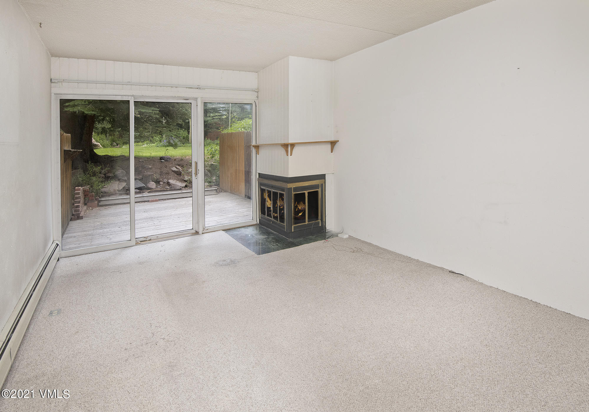 4506 Spruce Way, Unit 4 Vail, CO 81657 - Photo 3 of 31 a view of an empty room with a fireplace
