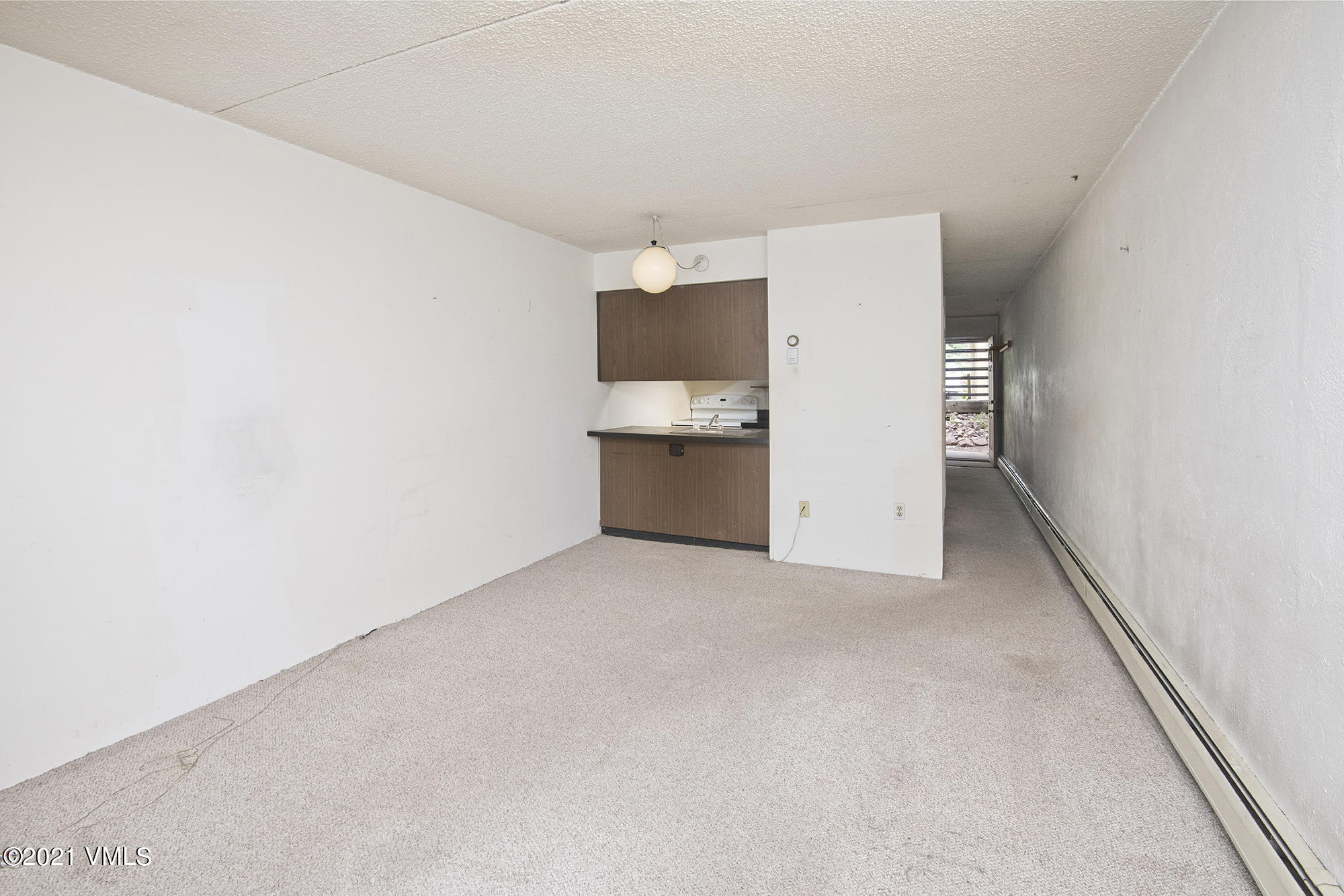 4506 Spruce Way, Unit 4 Vail, CO 81657 - Photo 4 of 31 an empty room with a kitchen
