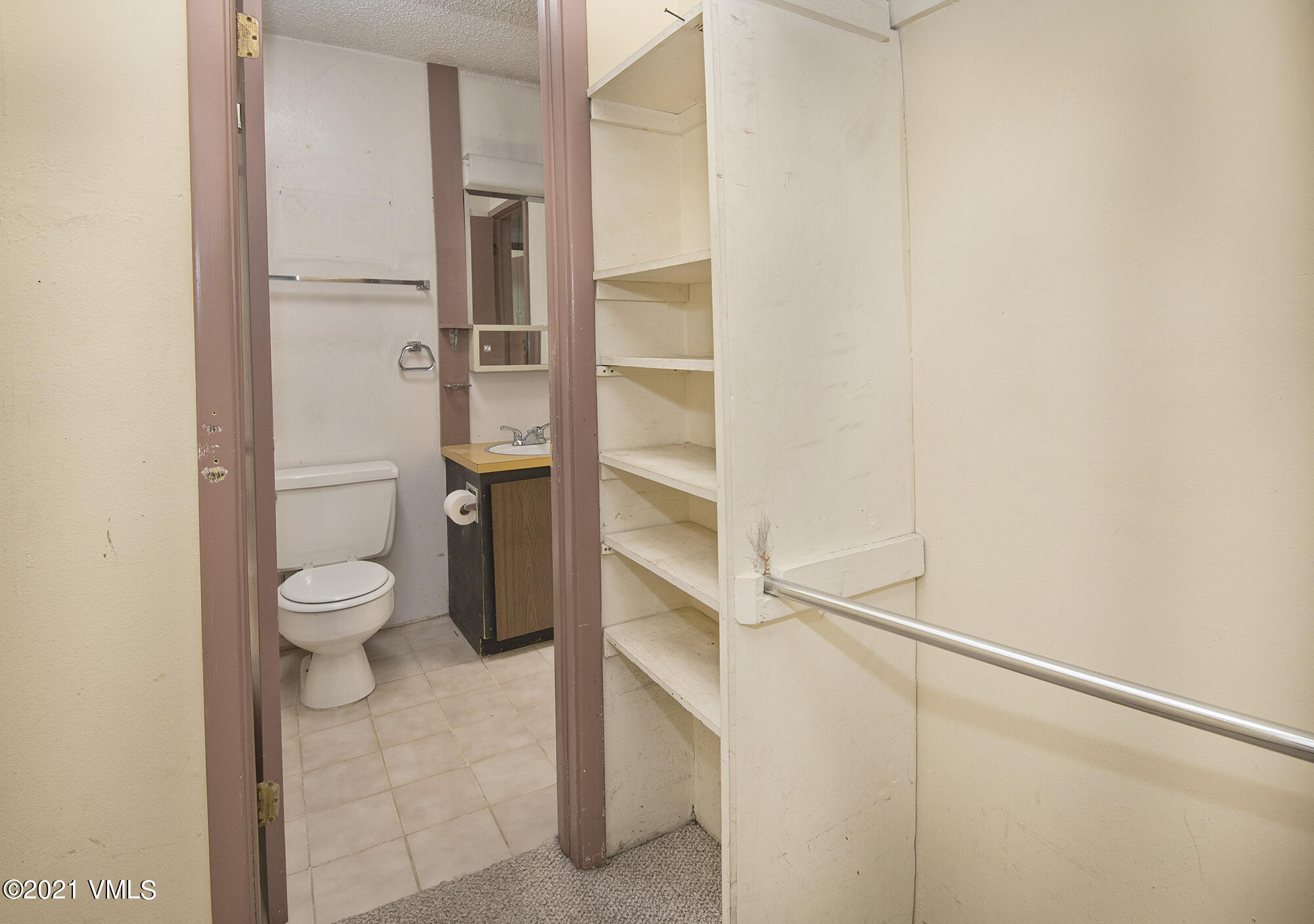 4506 Spruce Way, Unit 4 Vail, CO 81657 - Photo 9 of 31 a bathroom with a toilet and a vanity