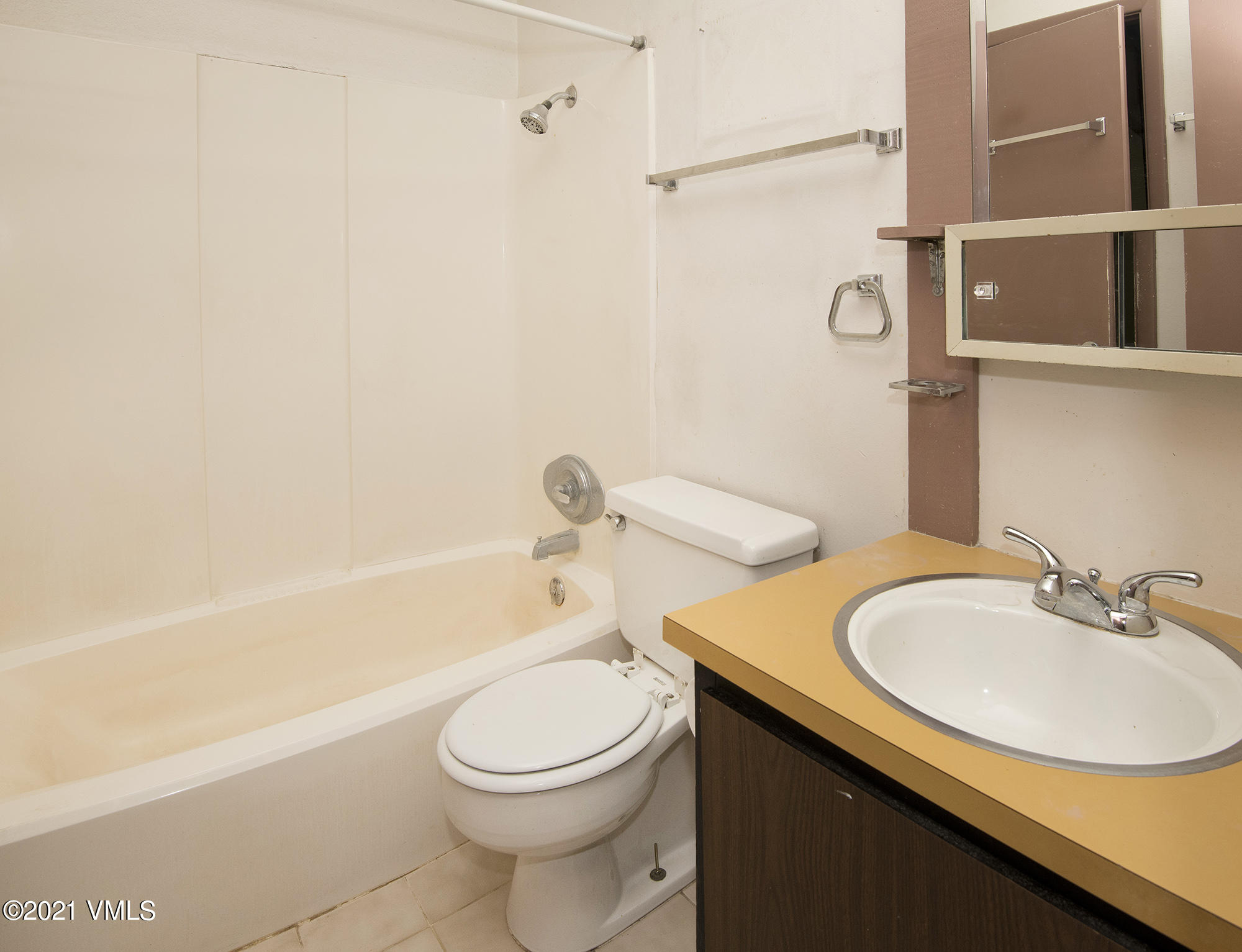 4506 Spruce Way, Unit 4 Vail, CO 81657 - Photo 10 of 31 a bathroom with a sink a toilet and bathtub