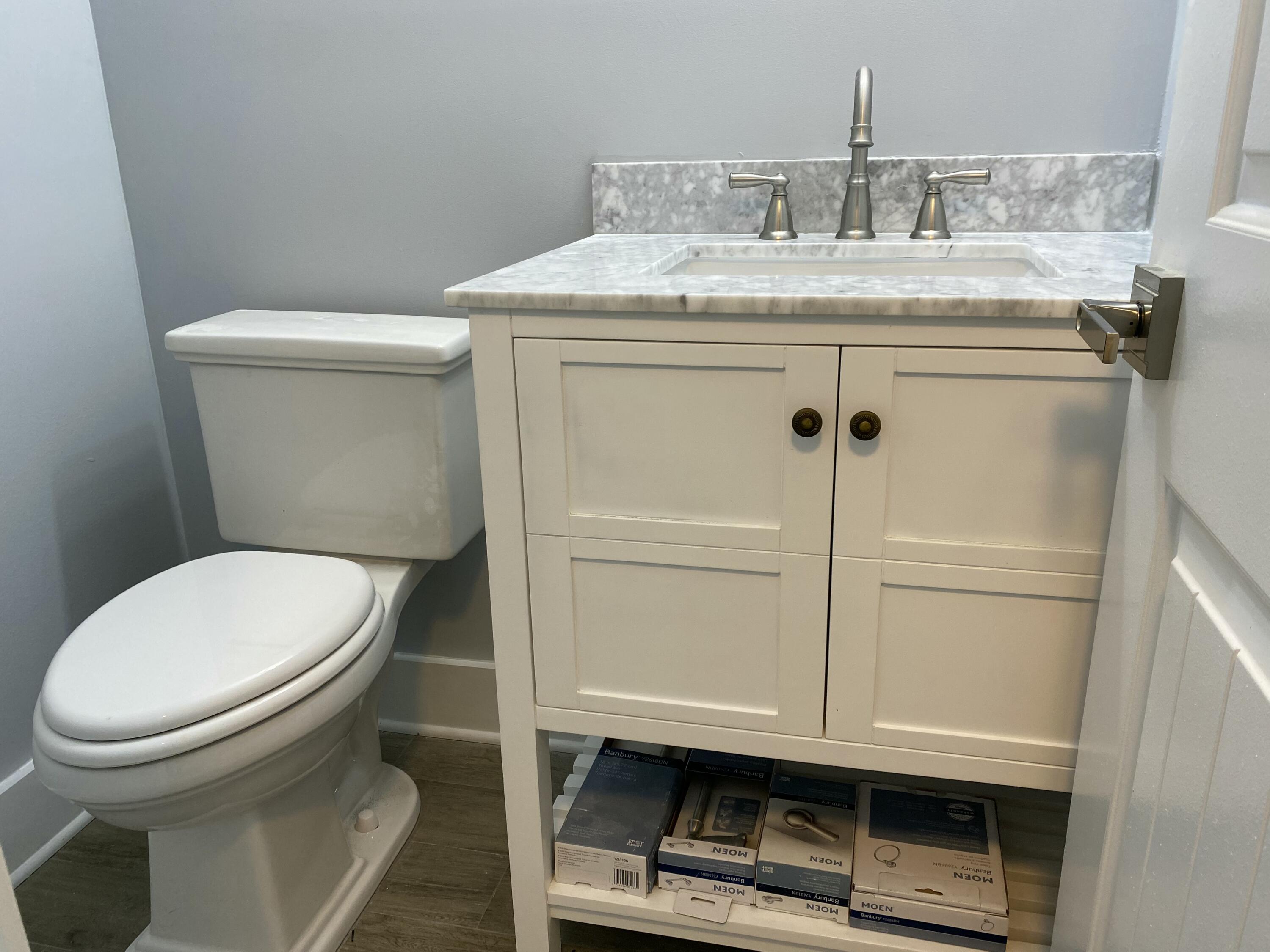 342 Mansfield Drive, Unit I Boca Raton, FL 33434 - Photo 13 of 17 a bathroom with a sink a toilet and a mirror