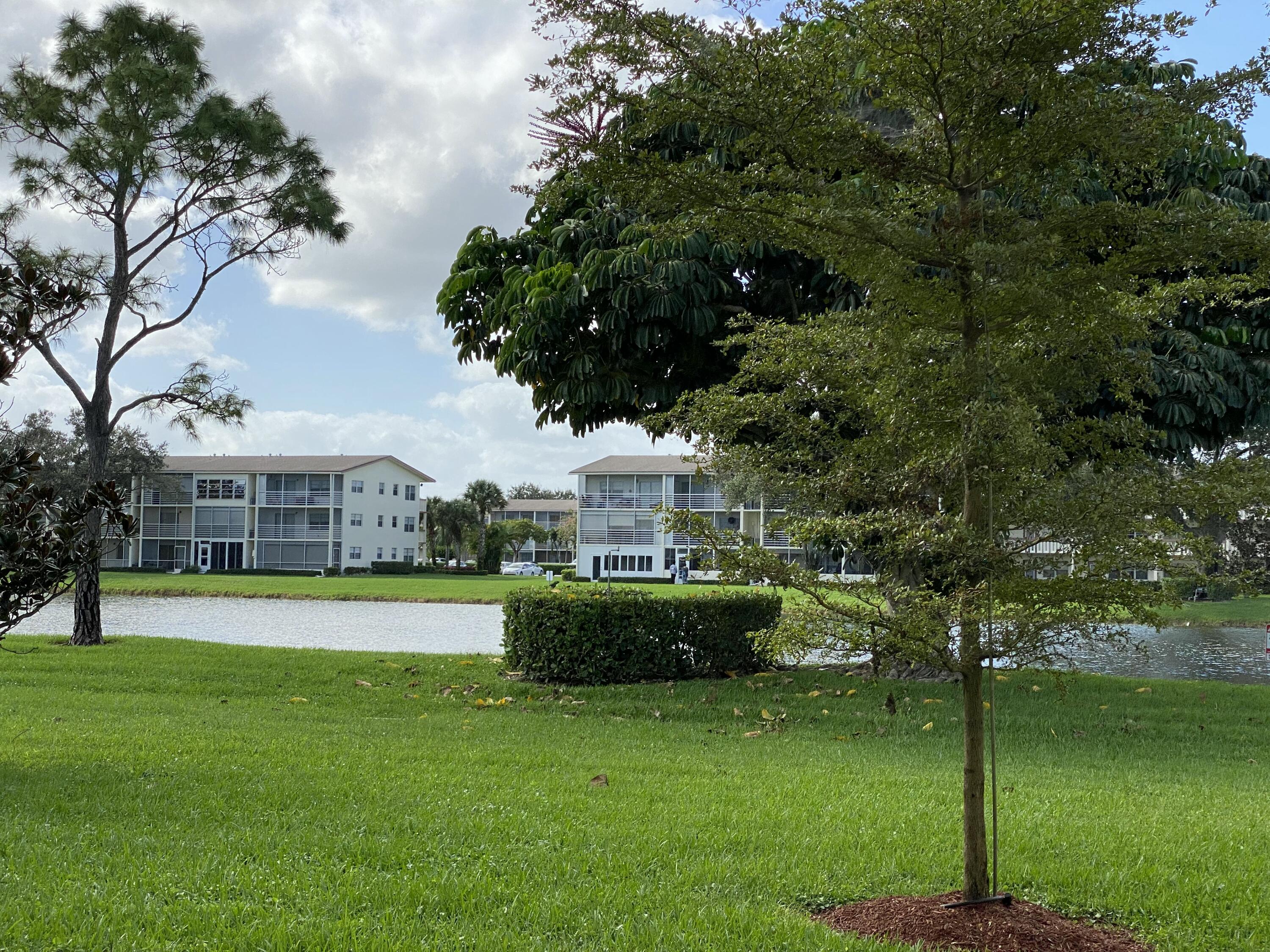 342 Mansfield Drive, Unit I Boca Raton, FL 33434 - Photo 16 of 17 a view of a house with a big yard