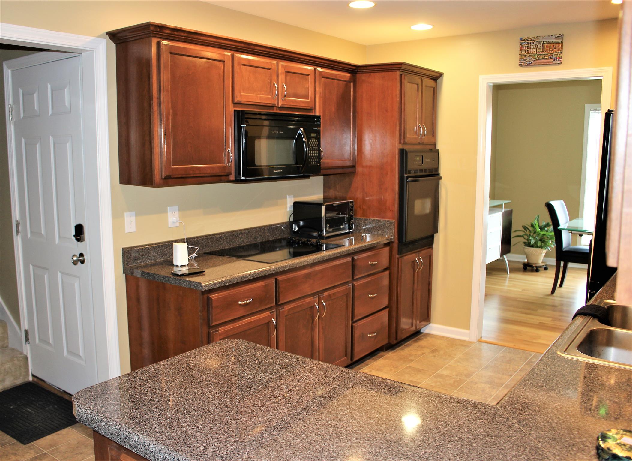 2220 Kinneys Road Cedar Hill, TN 37032 - Photo 11 of 23 a kitchen with stainless steel appliances granite countertop a refrigerator and a sink