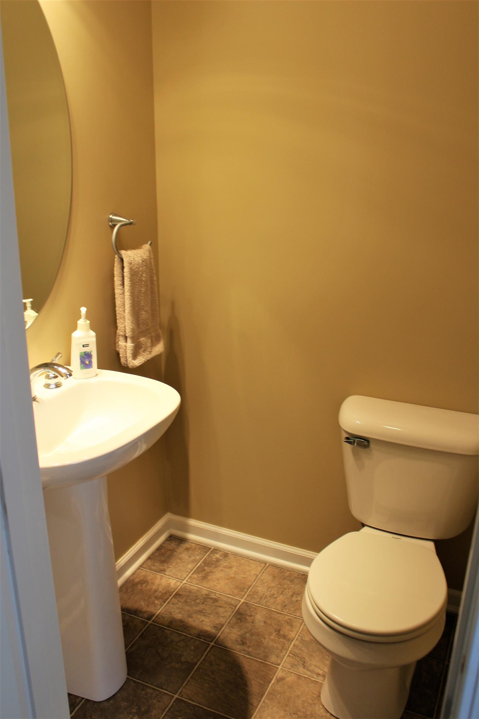 2220 Kinneys Road Cedar Hill, TN 37032 - Photo 16 of 23 a bathroom with a toilet and a sink