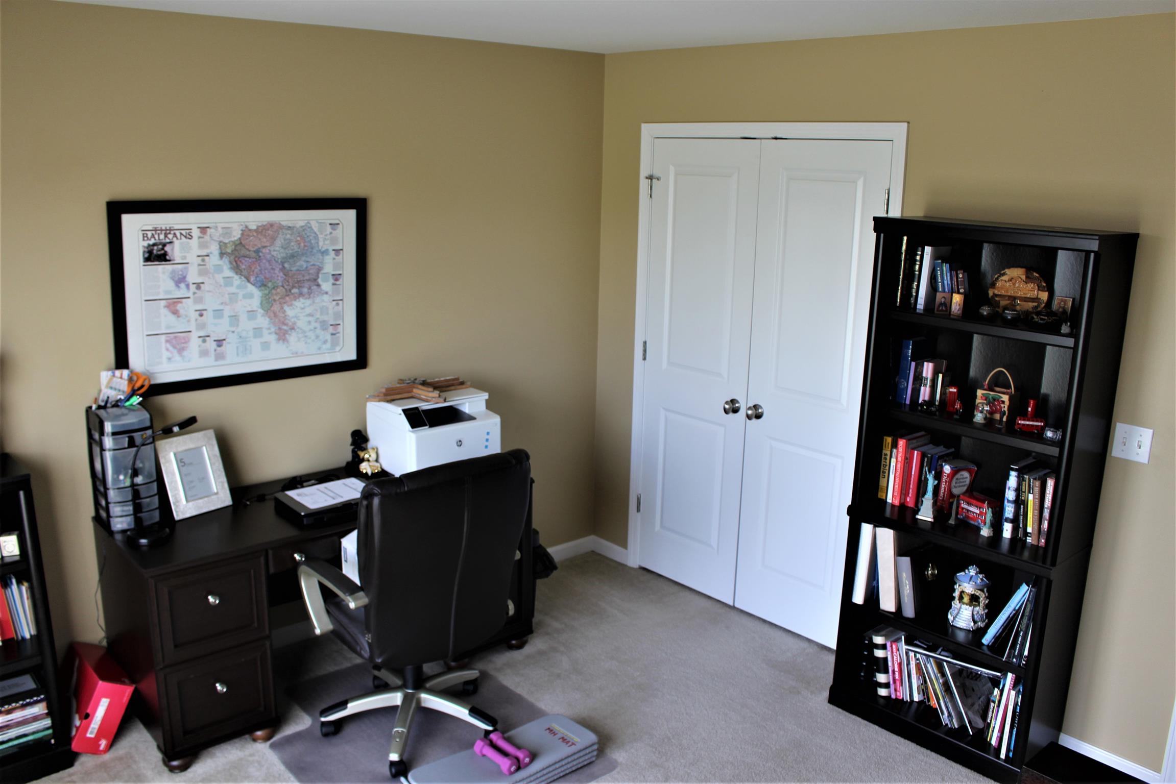 2220 Kinneys Road Cedar Hill, TN 37032 - Photo 17 of 23 a view of a workspace with furniture and bookshelf