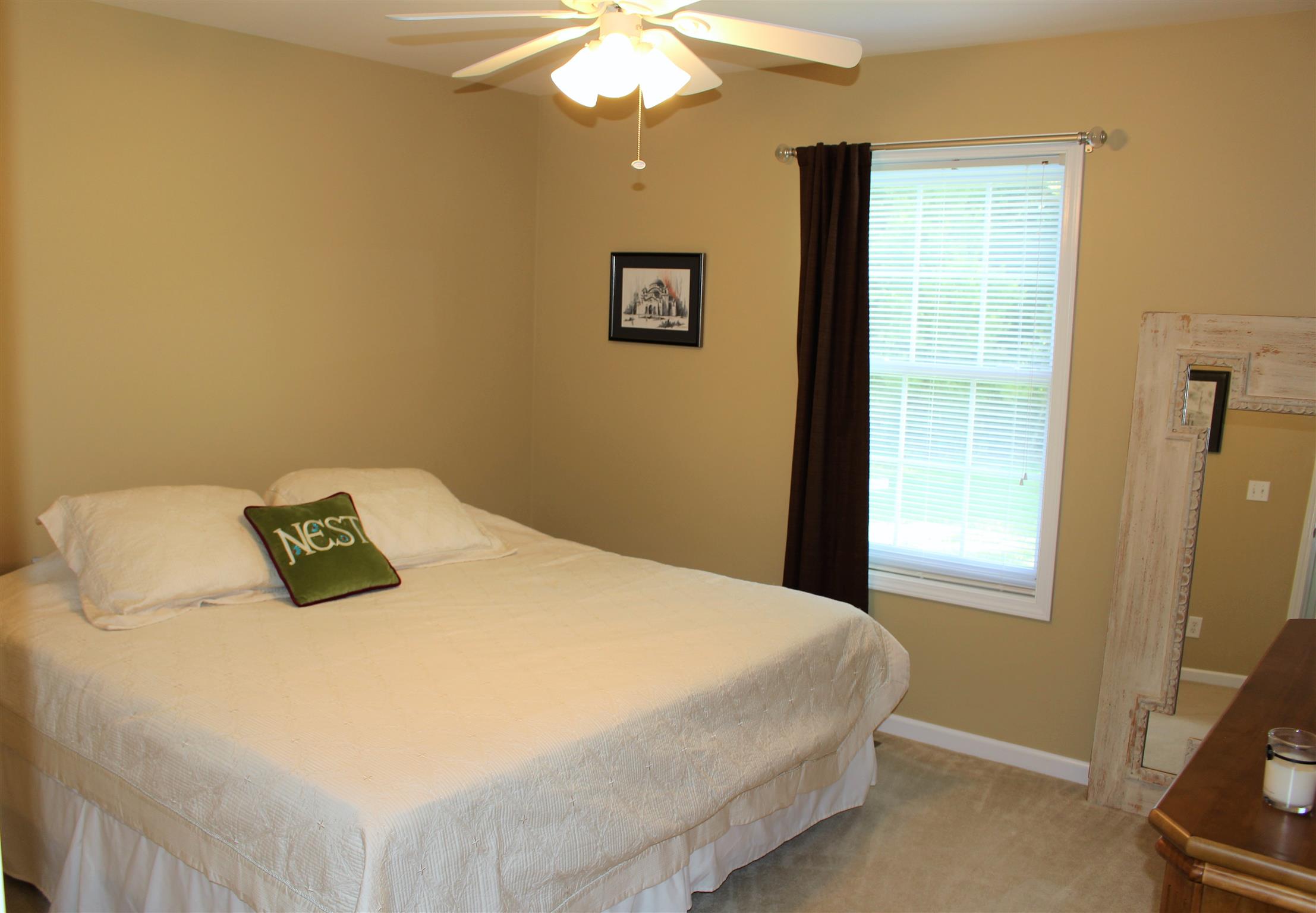 2220 Kinneys Road Cedar Hill, TN 37032 - Photo 20 of 23 a bedroom with a bed and a chandelier