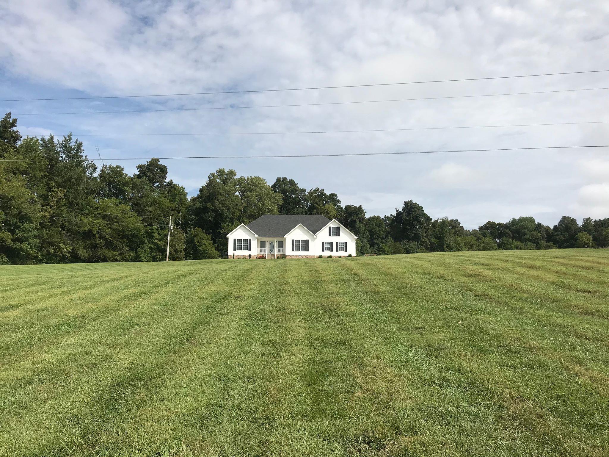2220 Kinneys Road Cedar Hill, TN 37032 - Photo 3 of 23 a view of a field of grass and trees