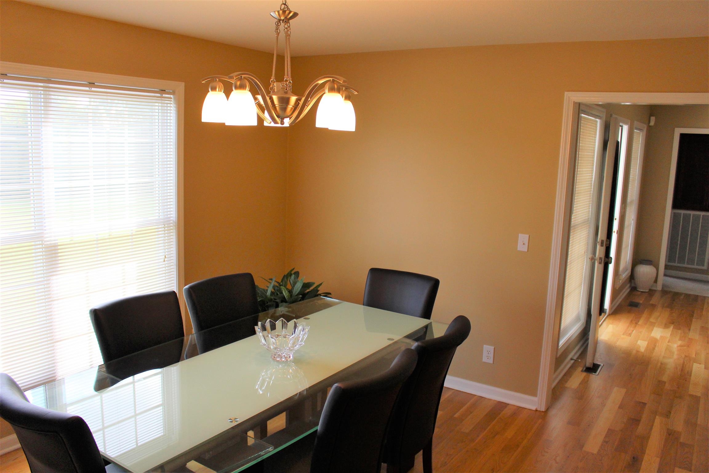 2220 Kinneys Road Cedar Hill, TN 37032 - Photo 9 of 23 a view of a dining room with furniture and wooden floor
