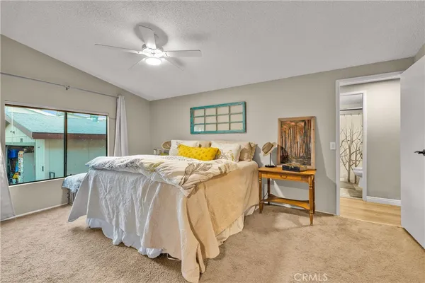 a bed room with a bed and a chandelier