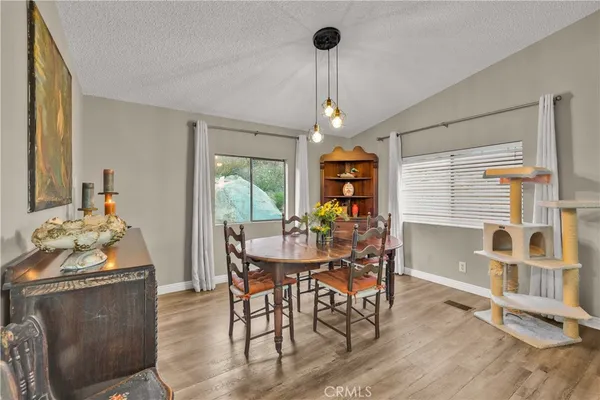 a kitchen with sink and natural light
