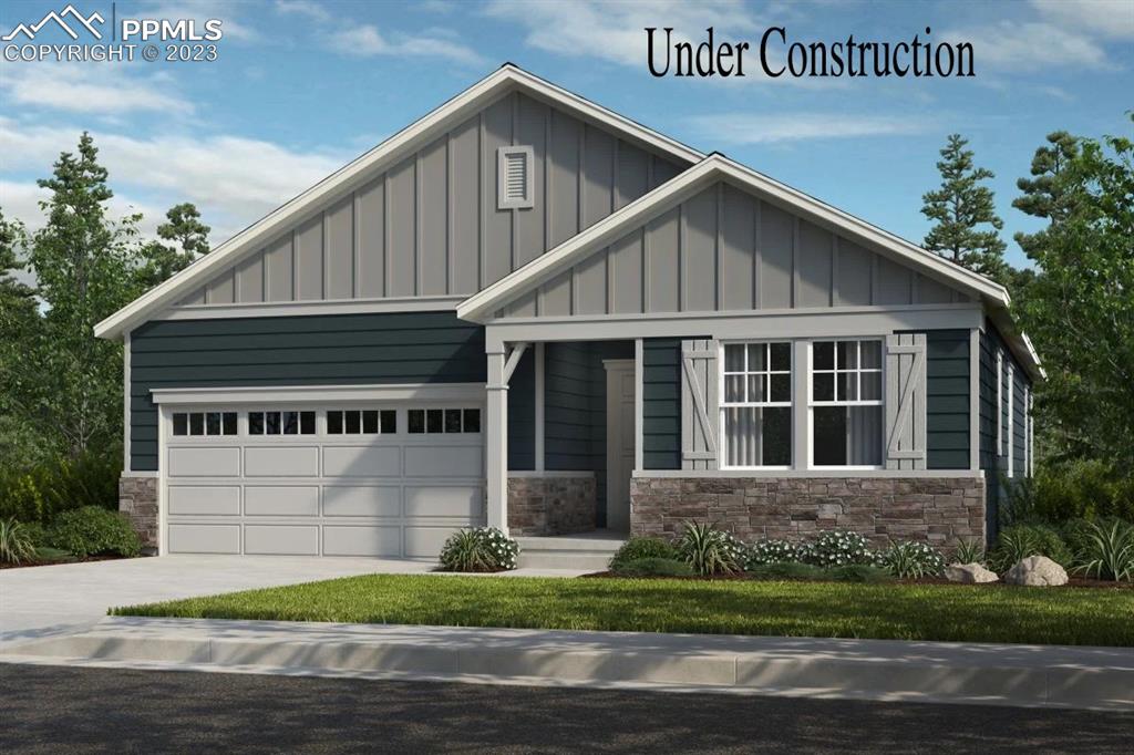 a view of a house with a yard plants and wooden fence