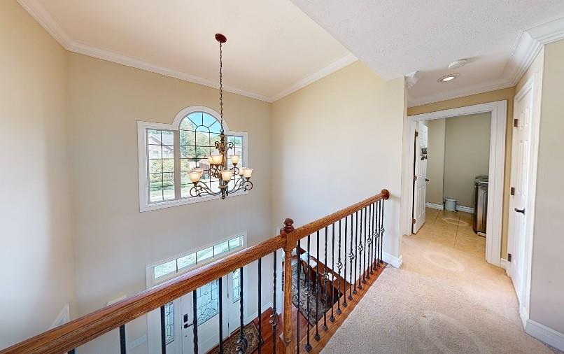 150 Eric Drive Beaver, PA 15009 - Photo 11 of 35 a view of a hallway with windows and chandelier
