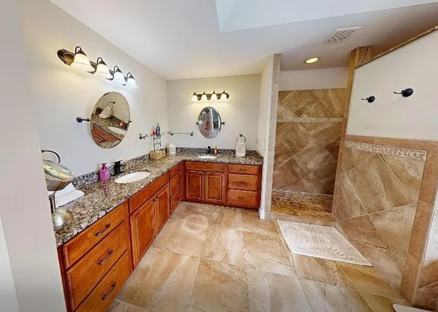 a kitchen with stainless steel appliances granite countertop a sink and cabinets