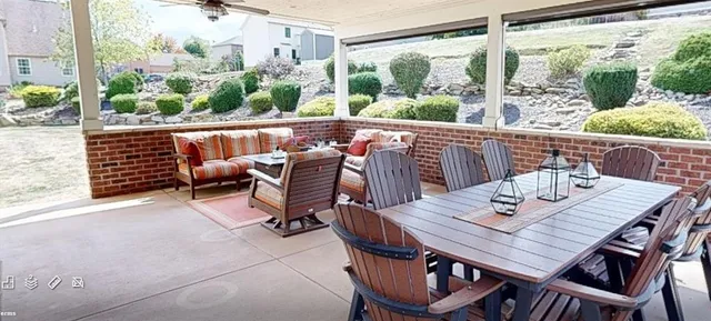 a view of a chairs and table in the patio
