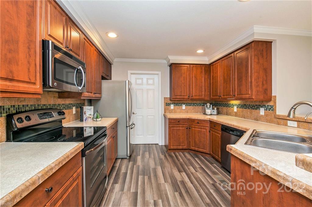 6130 Long Ferry Road Salisbury, NC 28146 - Photo 17 of 32 a kitchen with a sink stove and refrigerator