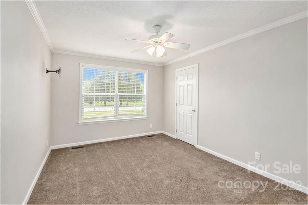 6130 Long Ferry Road Salisbury, NC 28146 - Photo 23 of 32 an empty room with windows and fan