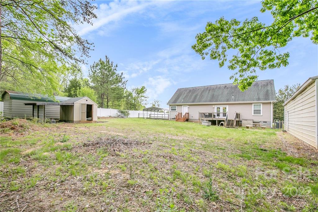 6130 Long Ferry Road Salisbury, NC 28146 - Photo 28 of 32 a view of a house with a yard and a garage