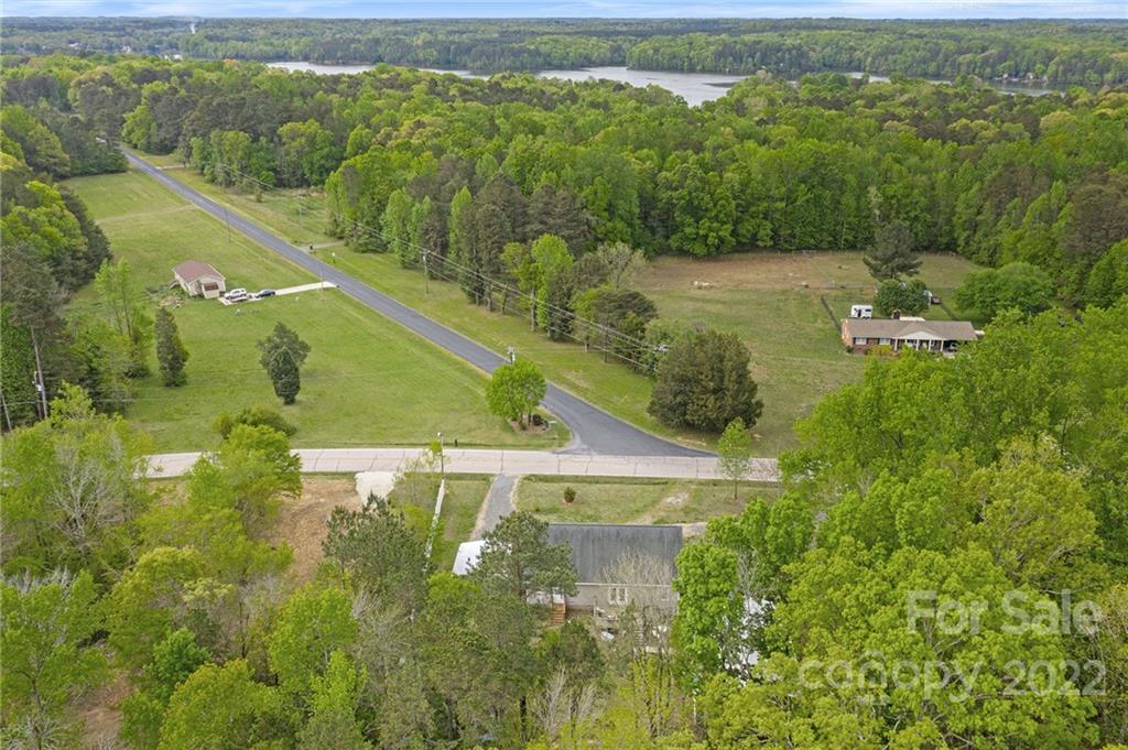 6130 Long Ferry Road Salisbury, NC 28146 - Photo 30 of 32 a view of a lake from a yard