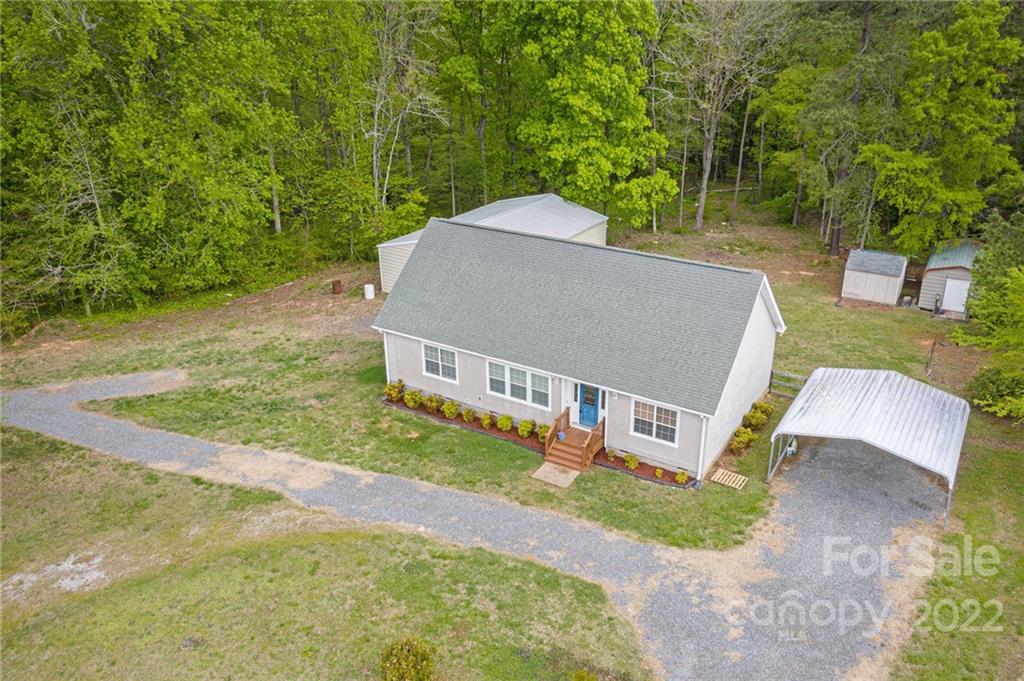 6130 Long Ferry Road Salisbury, NC 28146 - Photo 4 of 32 a view of a house with a yard and sitting area