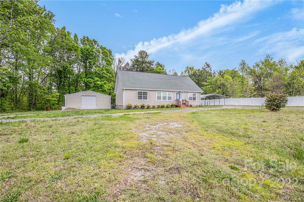 6130 Long Ferry Road Salisbury, NC 28146 - Photo 5 of 32 a house view with a garden space