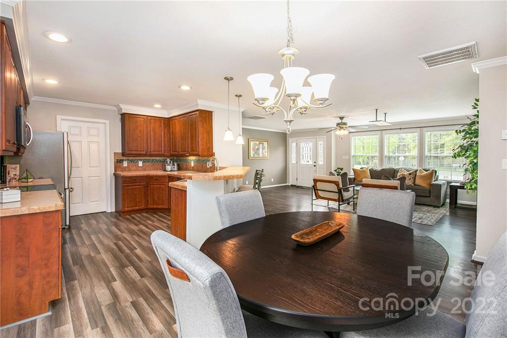 6130 Long Ferry Road Salisbury, NC 28146 - Photo 10 of 32 a large kitchen with a table chairs refrigerator and cabinets