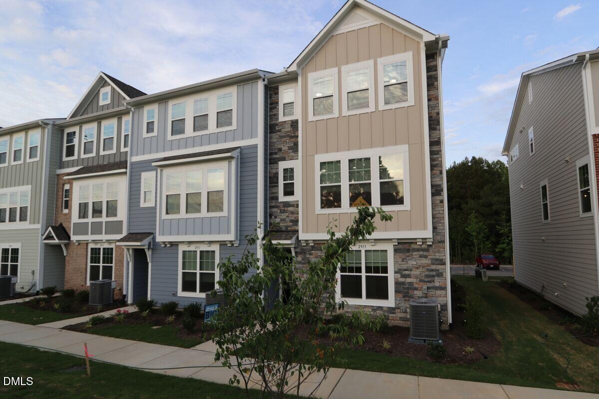2913 Richardson Road, Unit 475 Apex, NC 27502 - Photo 3 of 24 front view of a house with a yard