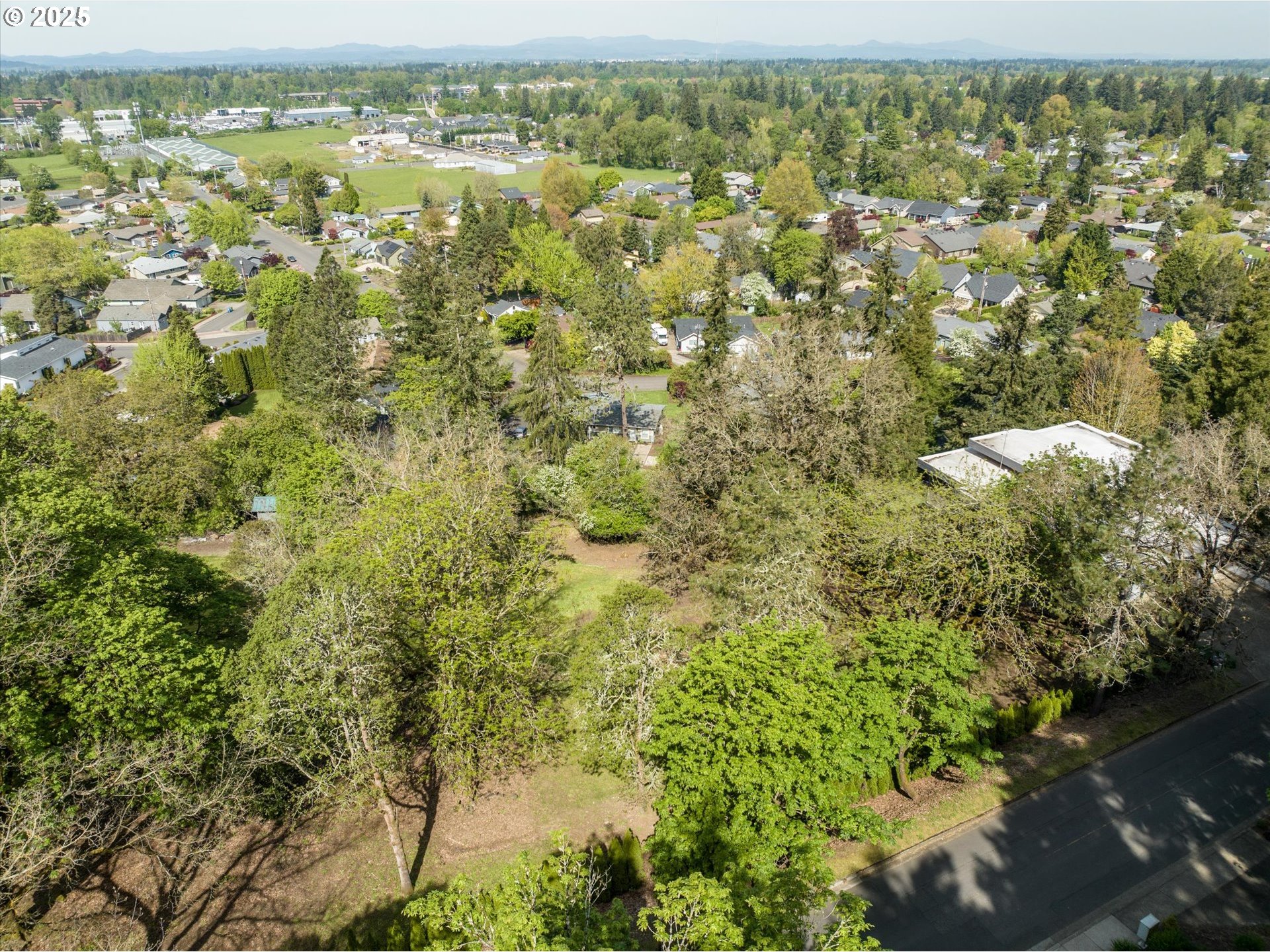 0 Crenshaw Road Eugene, OR 97401 - Photo 16 of 35 an aerial view of residential houses with outdoor space and trees