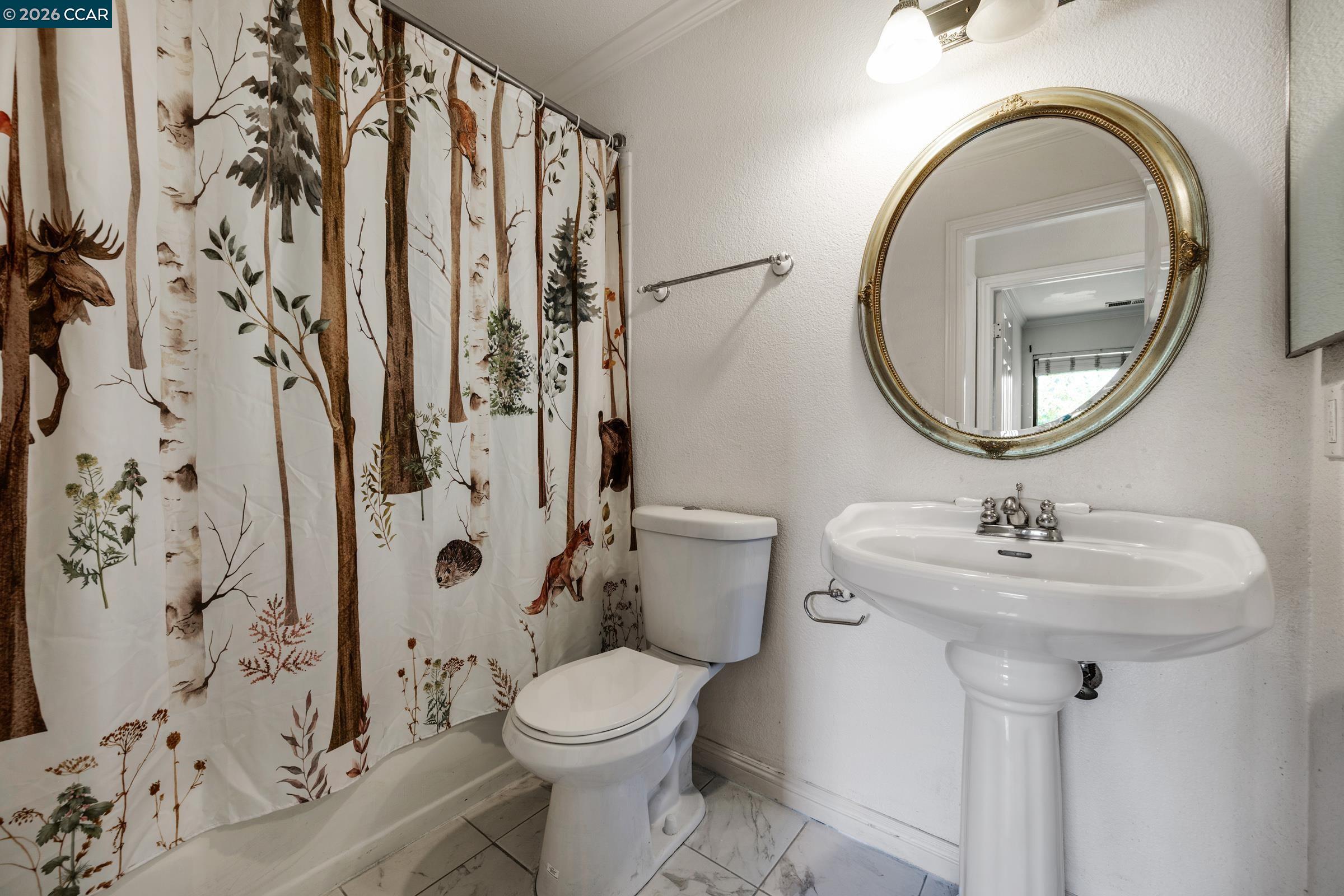 1544 Bailey Road, Unit 30 Concord, CA 94521 - Photo 16 of 33 a bathroom with a toilet sink and mirror