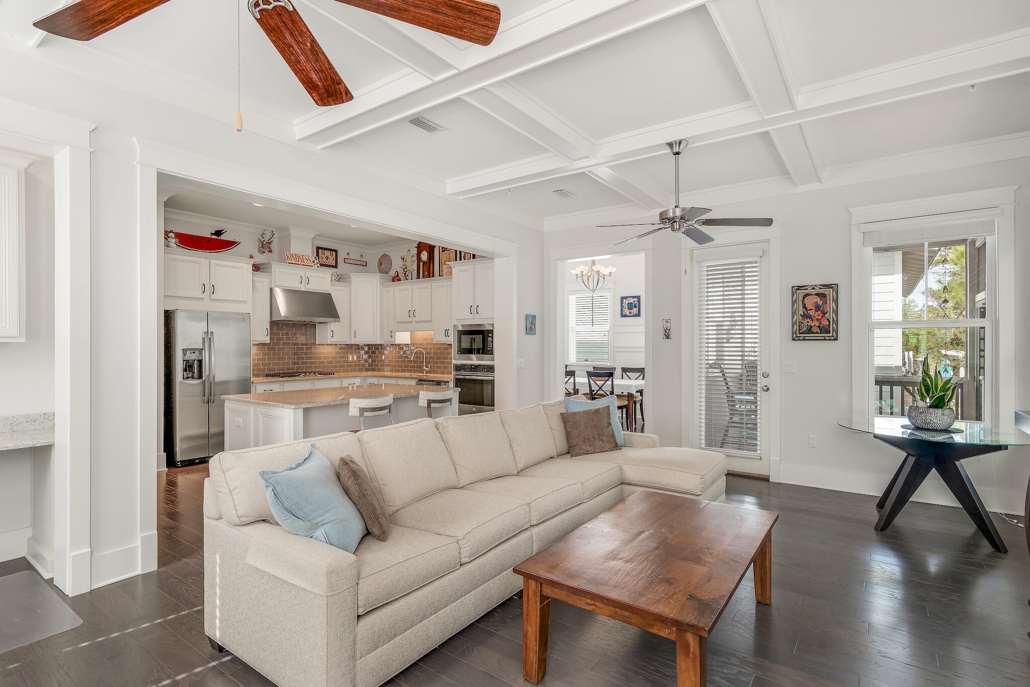 128 Emerald Beach Circle Santa Rosa Beach, FL 32459 - Photo 12 of 48 a living room with furniture and a wooden floor