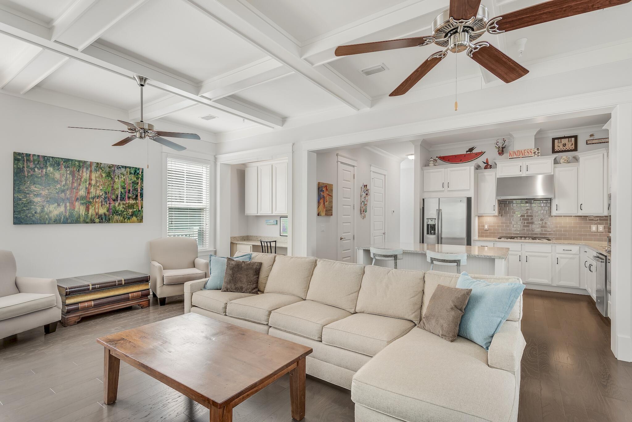 128 Emerald Beach Circle Santa Rosa Beach, FL 32459 - Photo 13 of 48 a living room with furniture and a chandelier