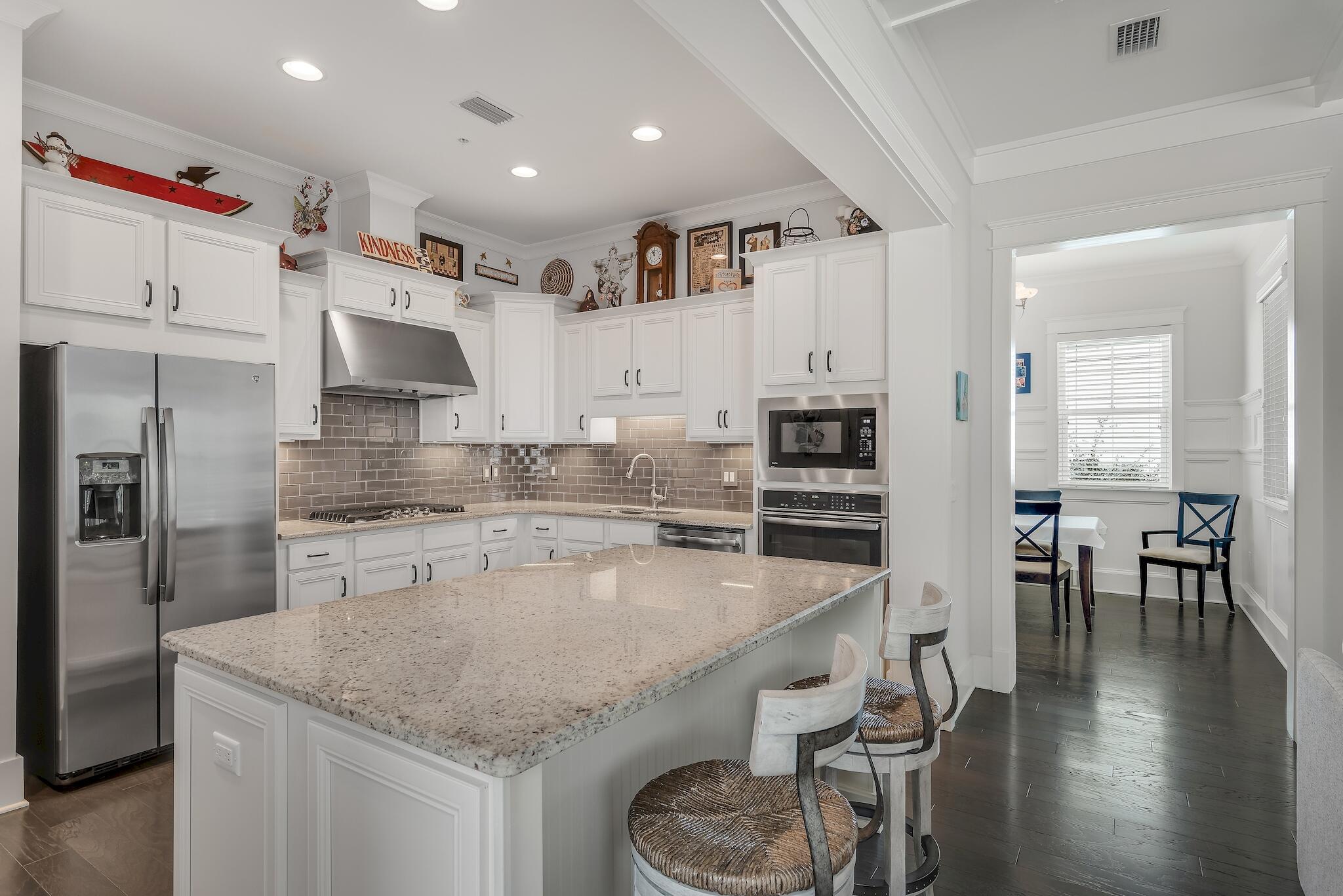 128 Emerald Beach Circle Santa Rosa Beach, FL 32459 - Photo 15 of 48 a kitchen with stainless steel appliances granite countertop a sink stove and refrigerator