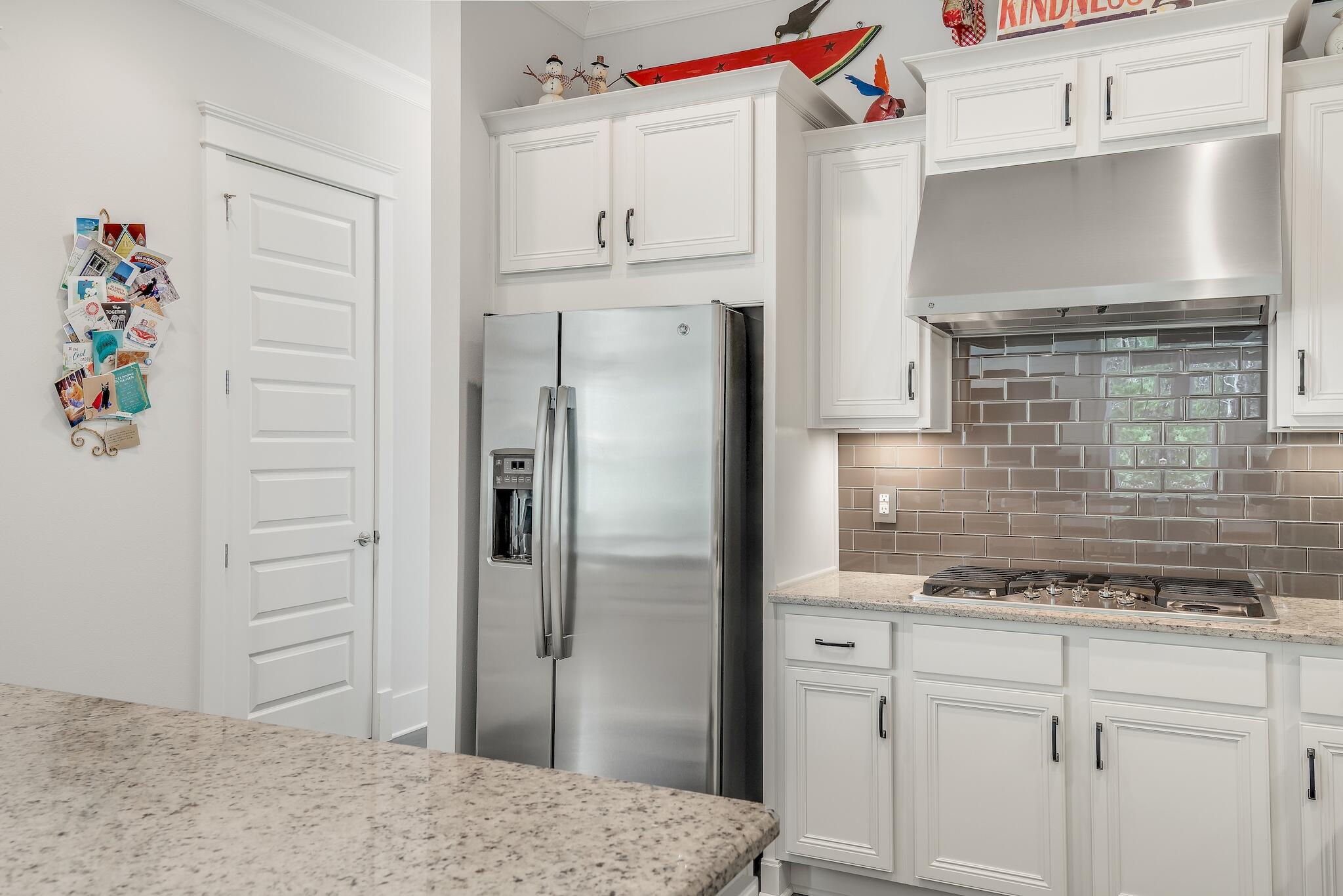 128 Emerald Beach Circle Santa Rosa Beach, FL 32459 - Photo 19 of 48 a kitchen with stainless steel appliances cabinets and a refrigerator