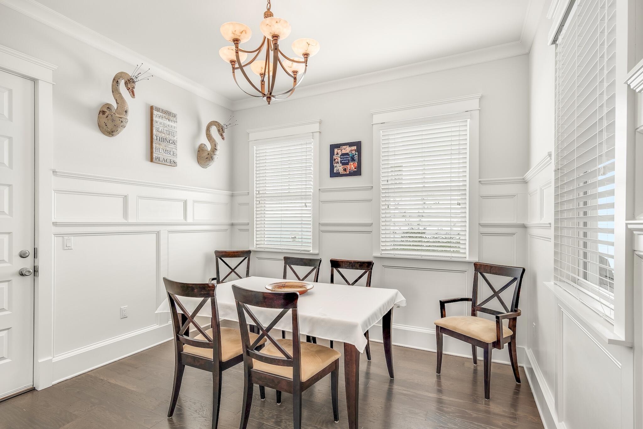 128 Emerald Beach Circle Santa Rosa Beach, FL 32459 - Photo 20 of 48 a view of a dining room with furniture and wooden floor