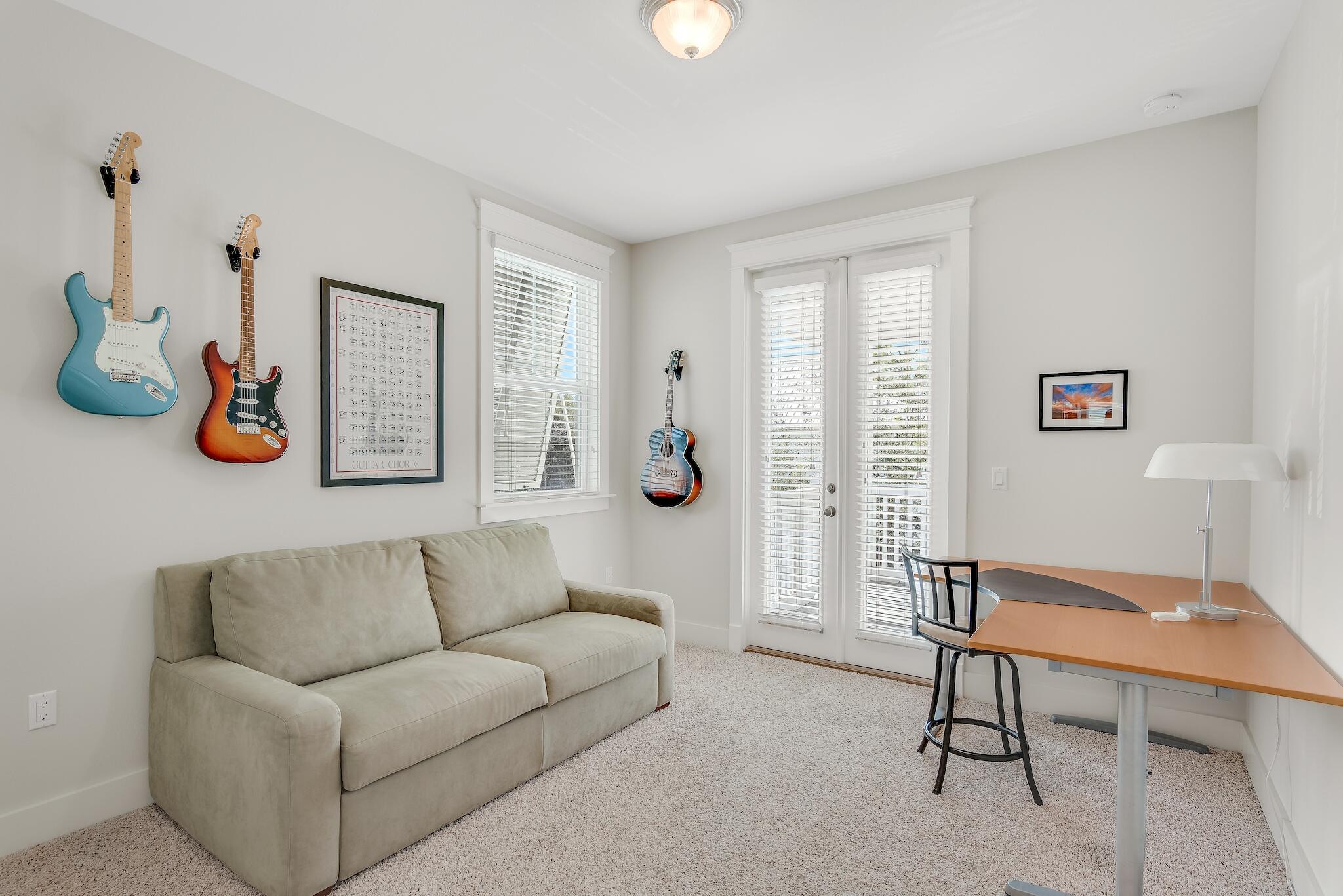 128 Emerald Beach Circle Santa Rosa Beach, FL 32459 - Photo 30 of 48 a living room with furniture and a window