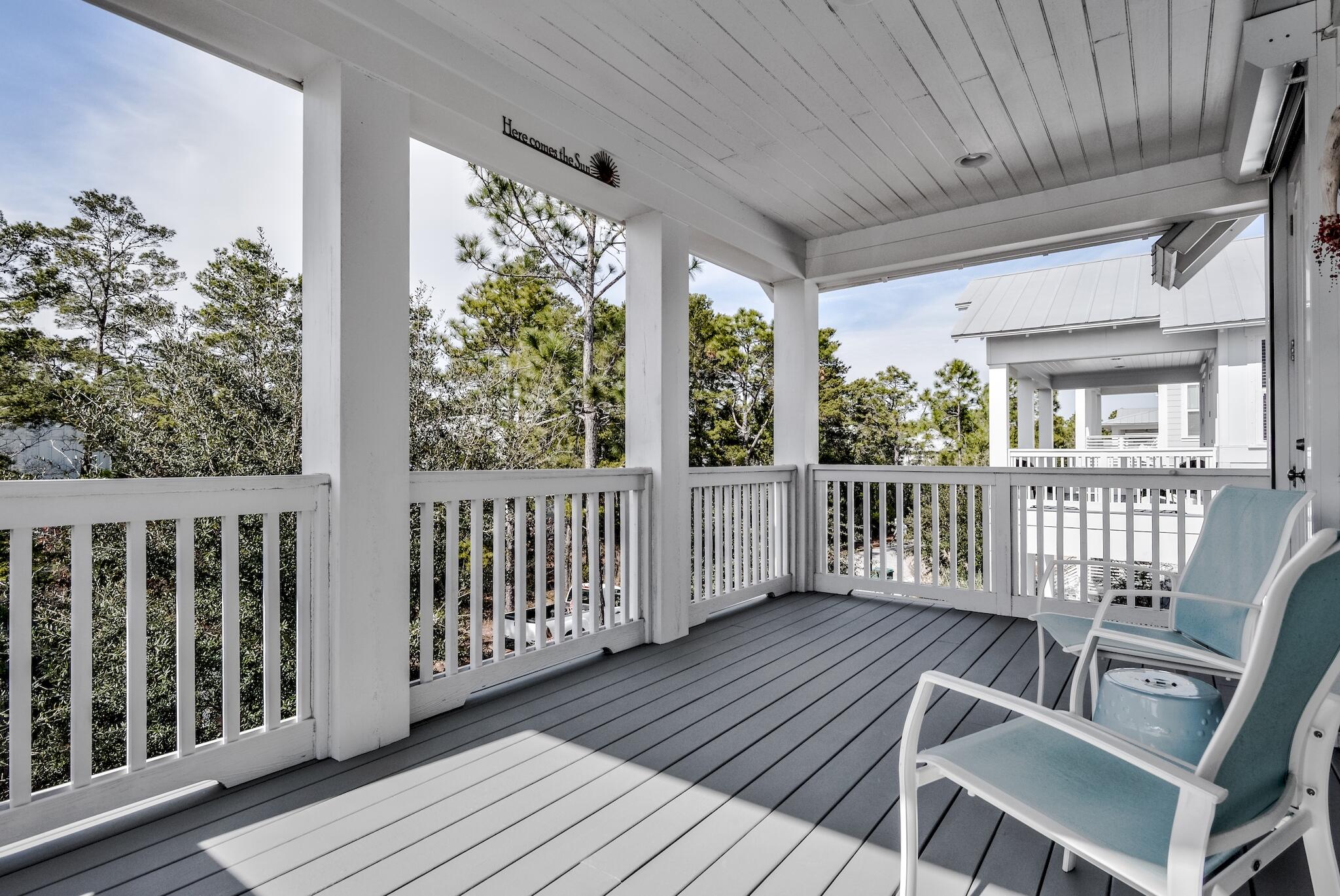 128 Emerald Beach Circle Santa Rosa Beach, FL 32459 - Photo 32 of 48 a view of a chairs on the deck