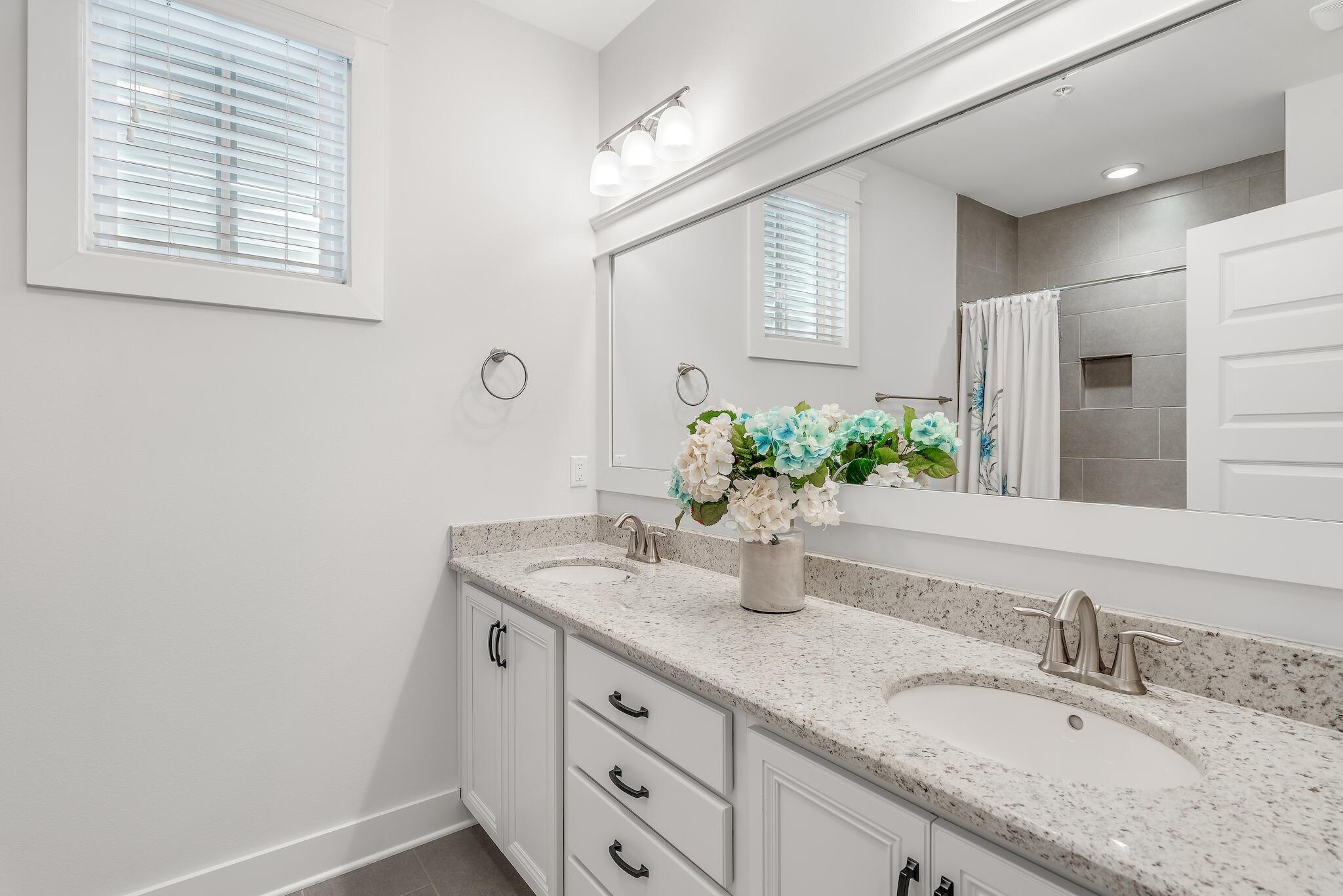 128 Emerald Beach Circle Santa Rosa Beach, FL 32459 - Photo 33 of 48 a bathroom with a granite countertop sink and a mirror