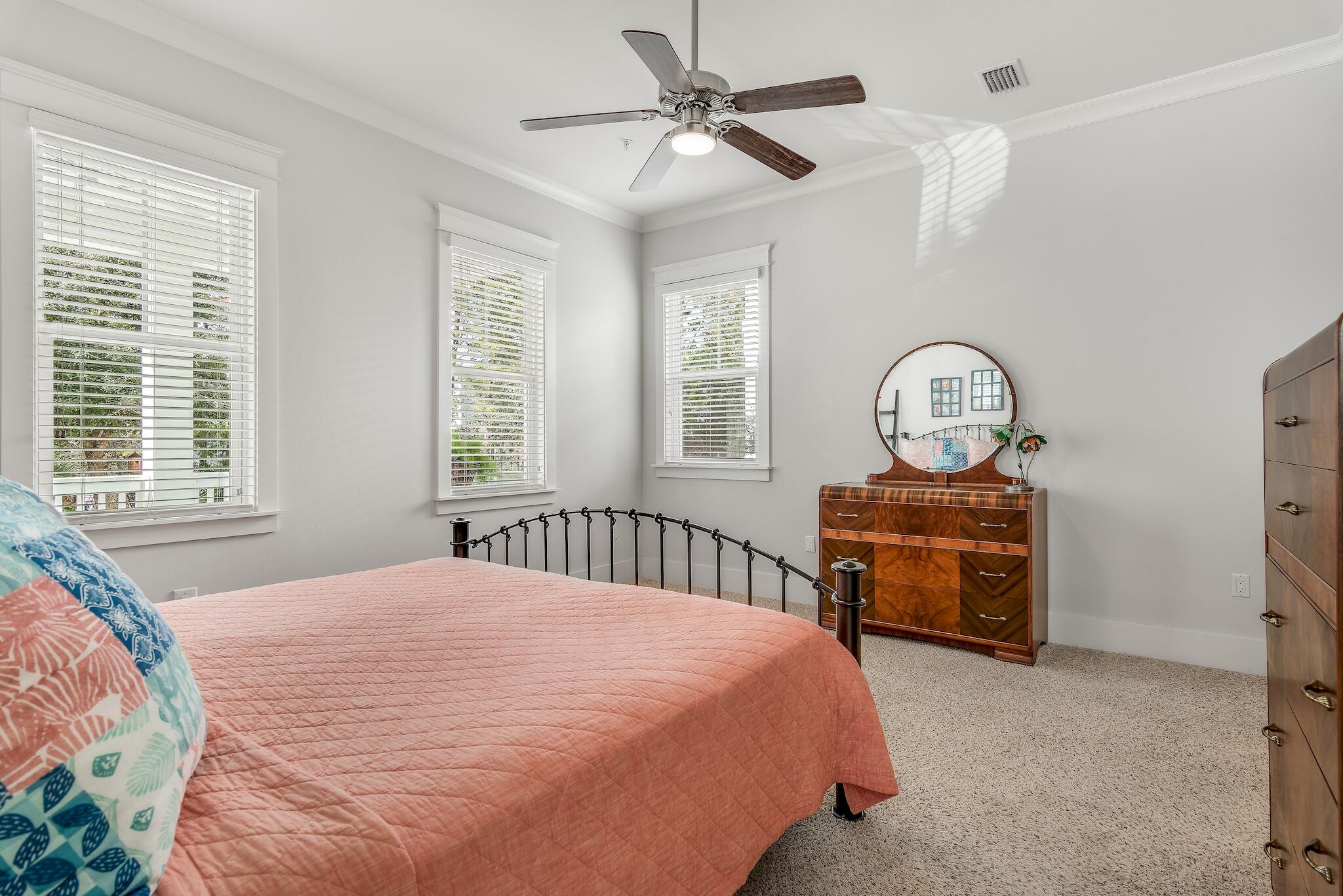 128 Emerald Beach Circle Santa Rosa Beach, FL 32459 - Photo 35 of 48 a bedroom with a bed window and dresser