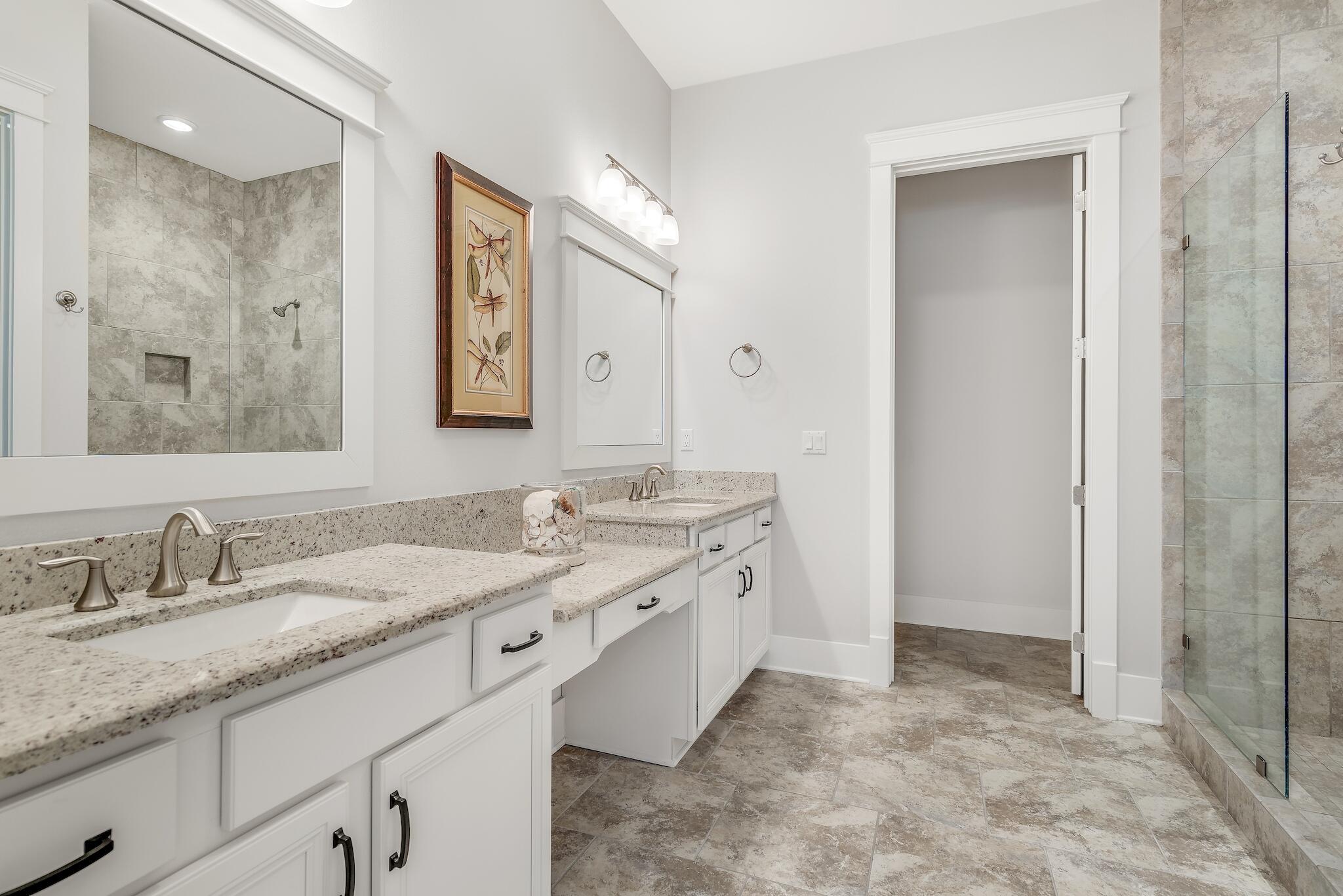 128 Emerald Beach Circle Santa Rosa Beach, FL 32459 - Photo 37 of 48 a bathroom with a granite countertop sink mirror and double