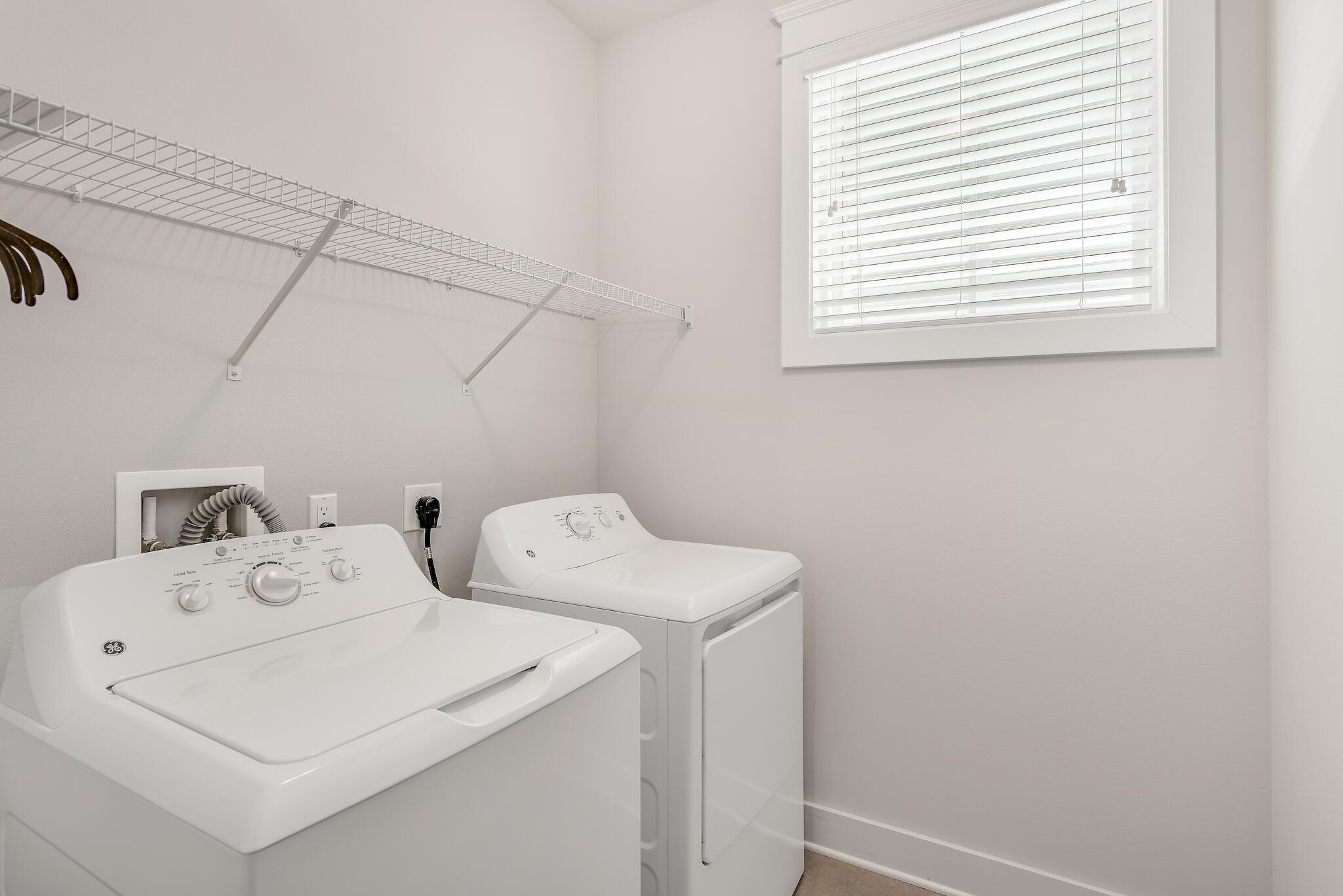 128 Emerald Beach Circle Santa Rosa Beach, FL 32459 - Photo 38 of 48 a utility room with dryer and washer
